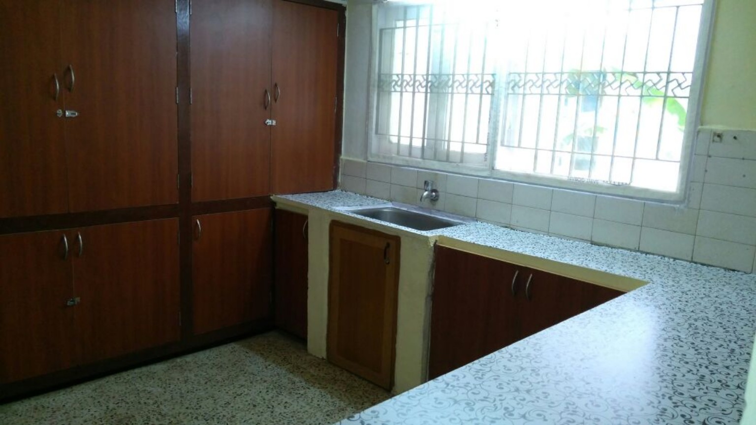 Kitchen and storage space at Veena Ladies PG